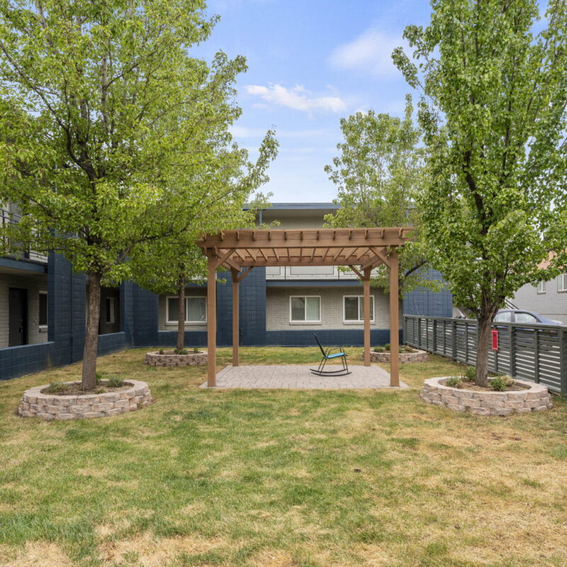 Apartment courtyard with pergola and trees