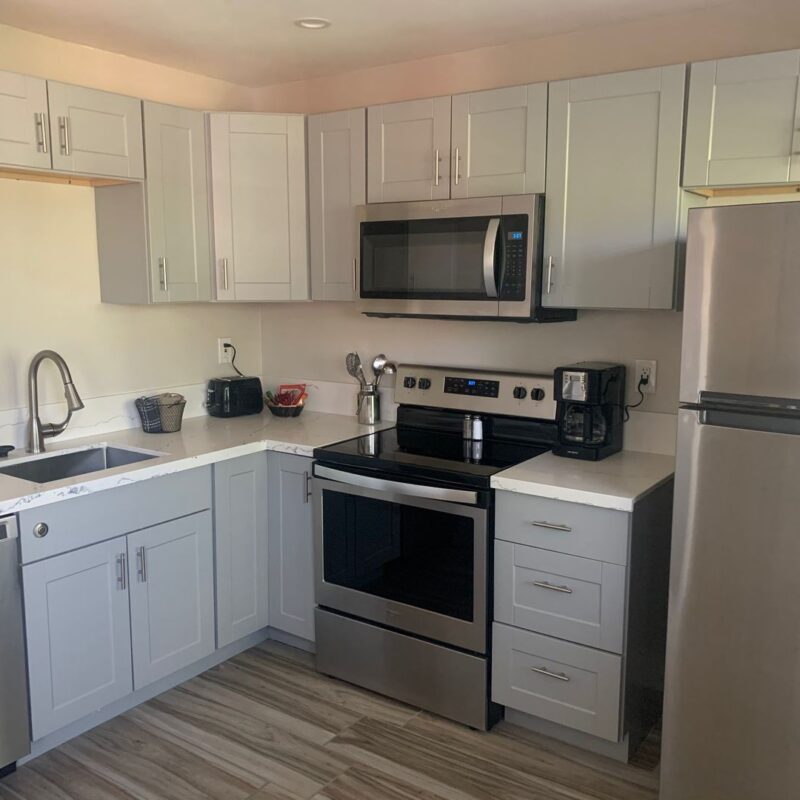 Modern kitchen with stainless steel appliances.